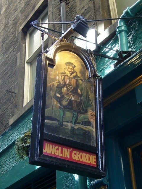 The hanging sign over the door, a painted figure of Jinglin’ Geordie